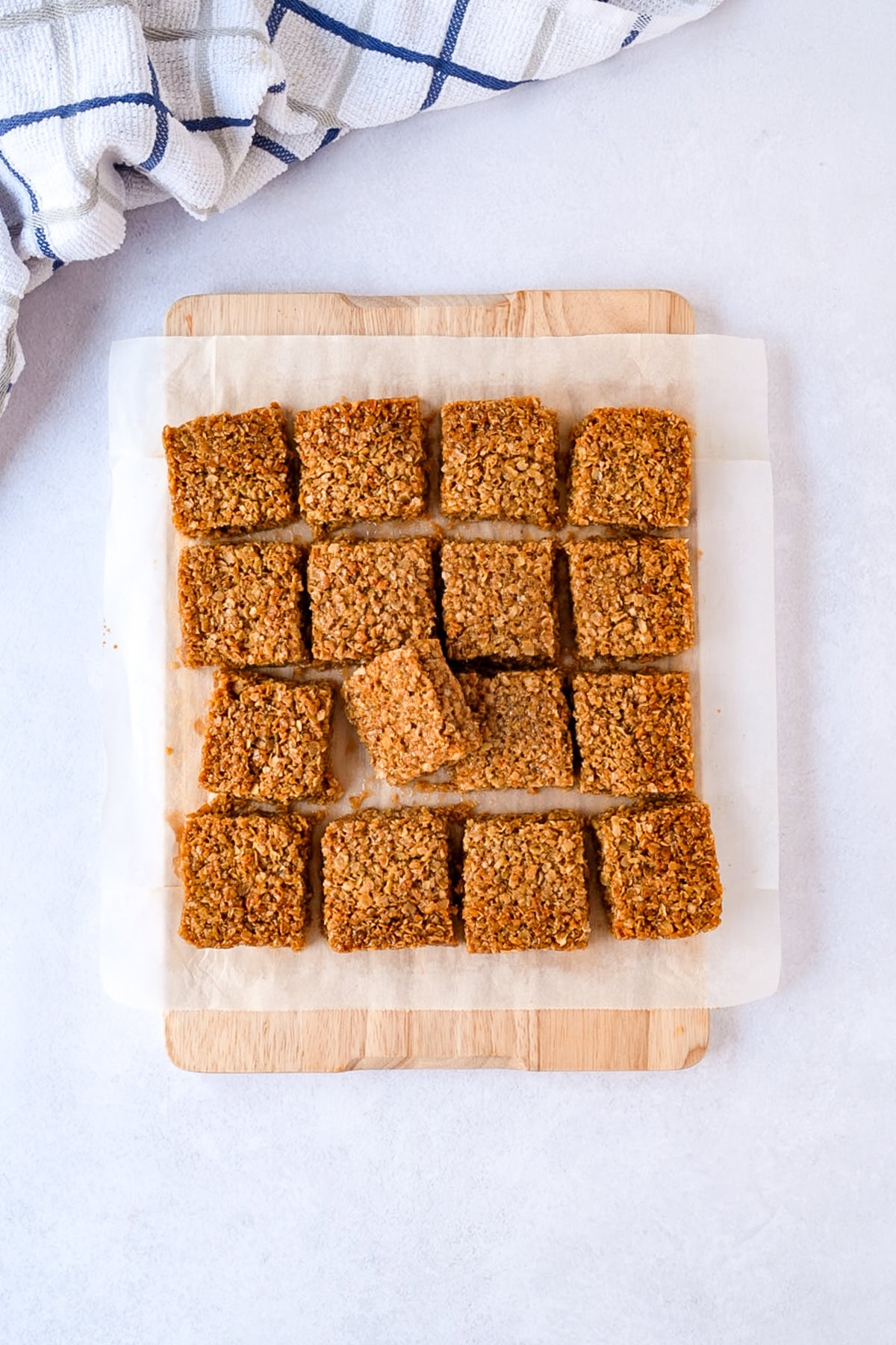 Cut flapjack squares showing the thick oat-filled centre.